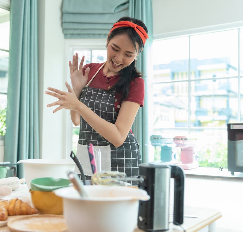 A woman in the kitchen making butter board ideas for fall from TikTok.
