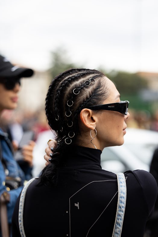 MILAN, ITALY - SEPTEMBER 21: A guest is seen wearing braids at Diesel show during the Milan Fashion ...