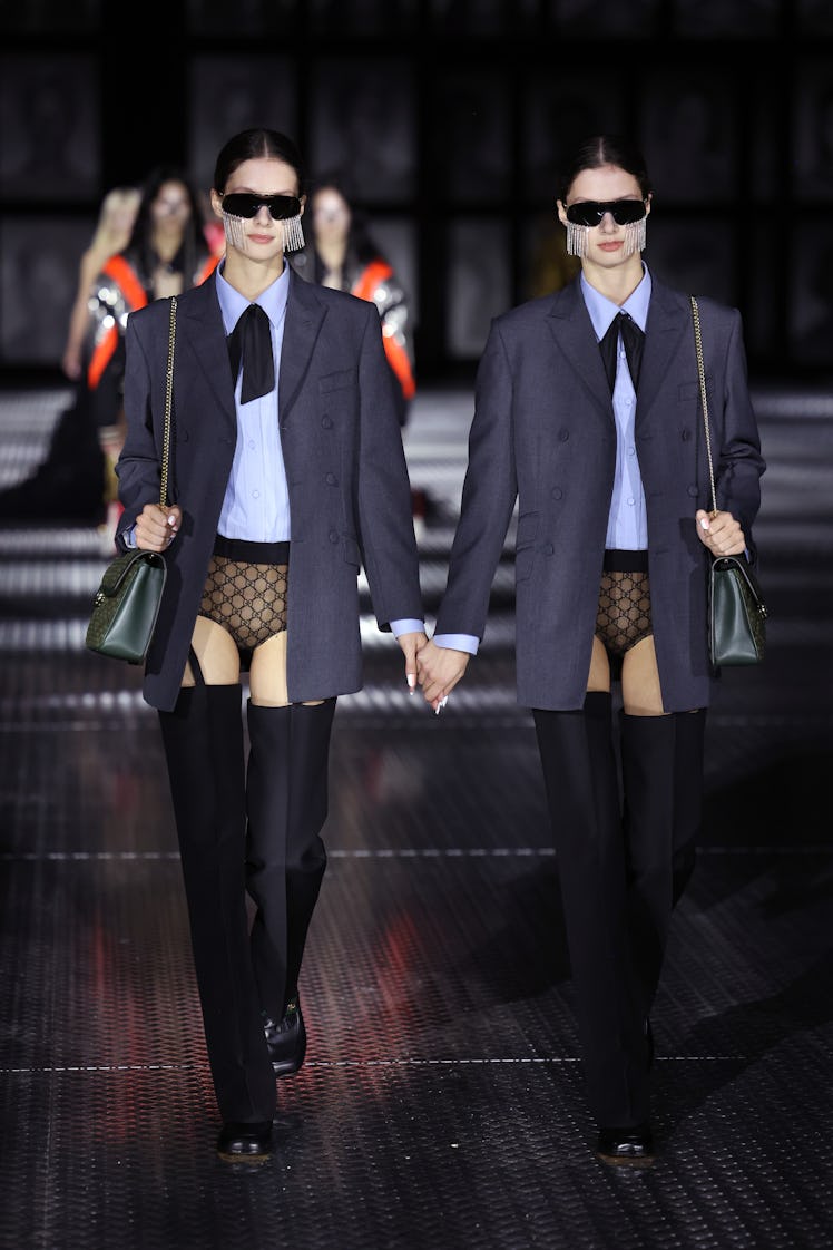 Models walking the runway of the Gucci Twinsburg Show during Milan Fashion Week Spring/Summer 2023 