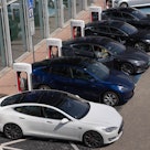 BRATISLAVA, SLOVAKIA - 2022/08/26: Vehicles seen at a Tesla charging station in Bratislava. EVs are ...