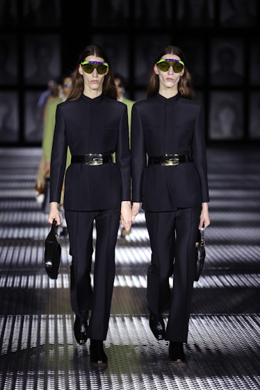 Models in all-black matching outfits during Gucci Twinsburg Show during Milan Fashion Week Spring/Su...