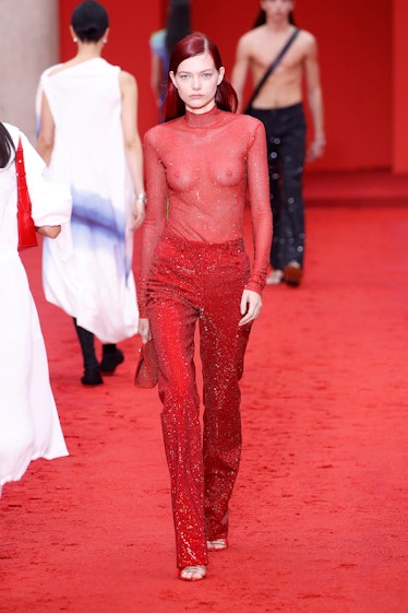 The model wearing a red outfit from Salvatore Ferragamo's Spring/Summer 2023 collection 