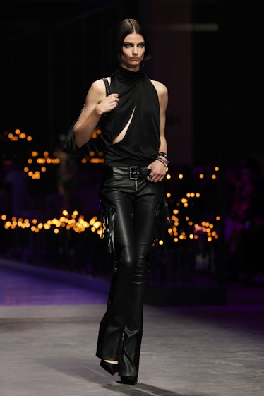 A model walking the runway of the Versace Fashion Show during the Milan Fashion Week 