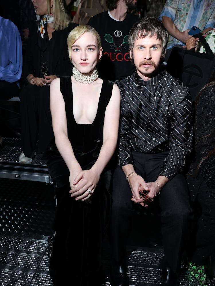 MILAN, ITALY - SEPTEMBER 23: Julia Garner and Mark Foster is seen at the Gucci Show during Milan Fas...