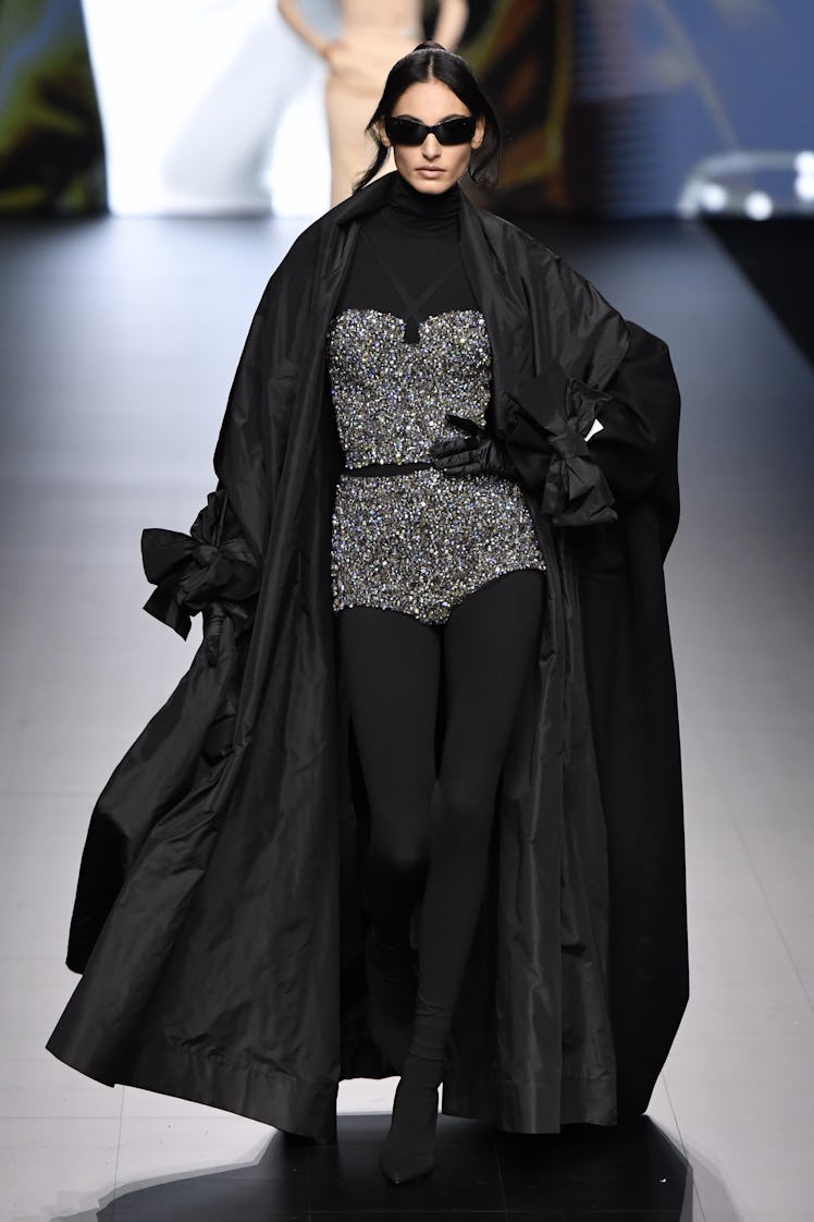 A model walking the runway in a look from Dolce & Gabbana's Ready to Wear Spring/Summer 2023 collect...