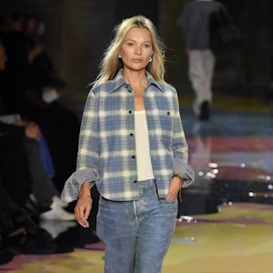 Kate Moss wears pair of baggy blues with a laidback flannel on Bottega Veneta runway