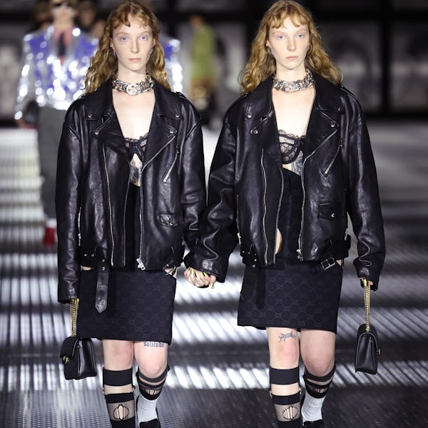 Twin models wear black leather jackets at Gucci's Twinsburg Show 