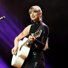 Taylor Swift, seen here wearing black and playing guitar, is releasing her album 'Midnights' on Oct....