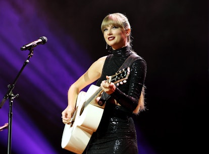 Taylor Swift, seen here wearing black and playing guitar, is releasing her album 'Midnights' on Oct....