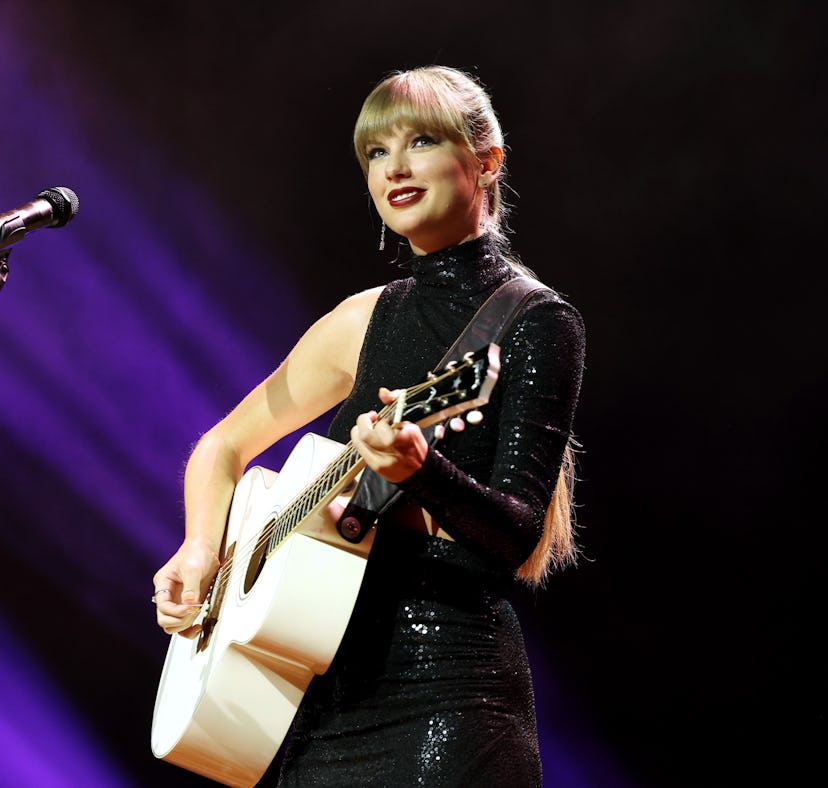 Taylor Swift, seen here wearing black and playing guitar, is releasing her album 'Midnights' on Oct....