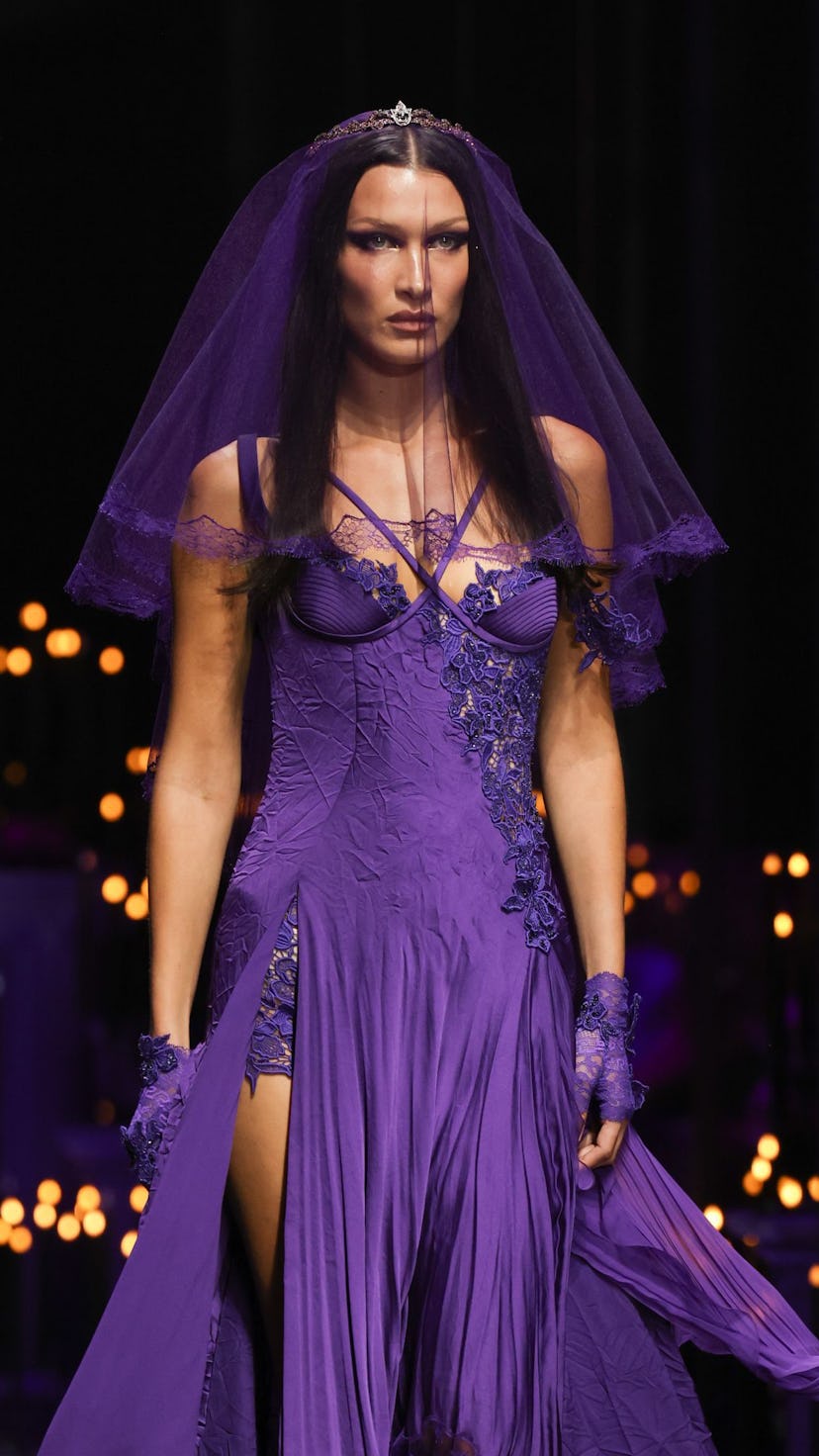 Bella Hadid in a purple wedding dress and veil at Versace's Fashion Show during the Milan Fashion We...