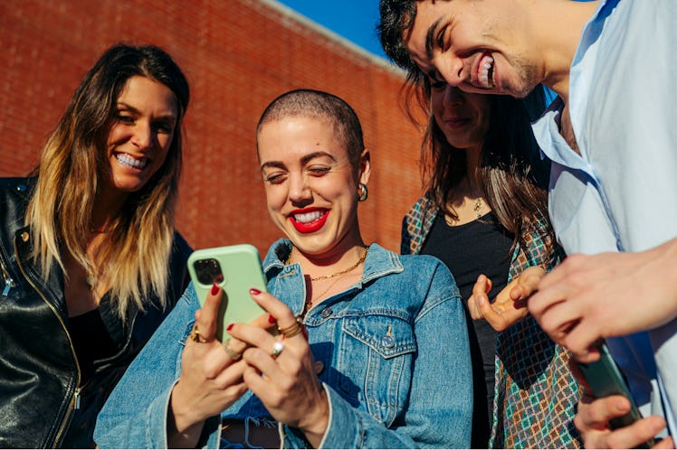 Group of friends in the street think of a caption for college memories.