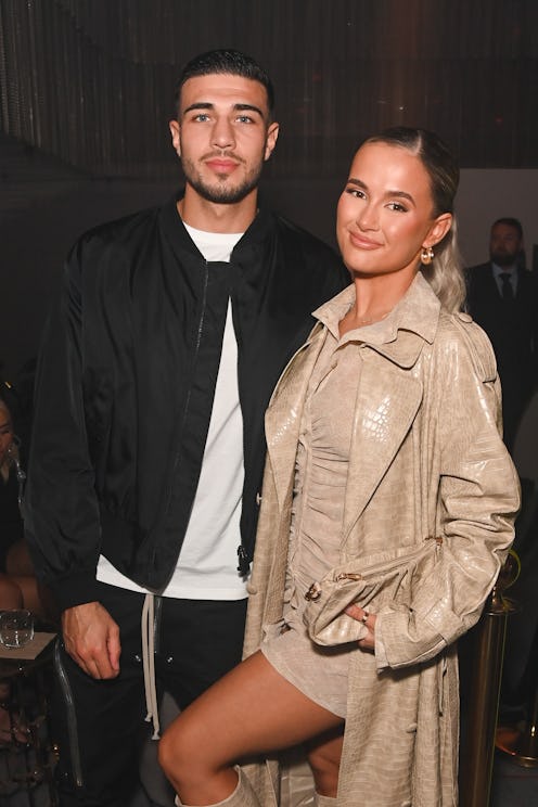 Tommy Fury and Molly-Mae Hague standing next to each other on the red carpet