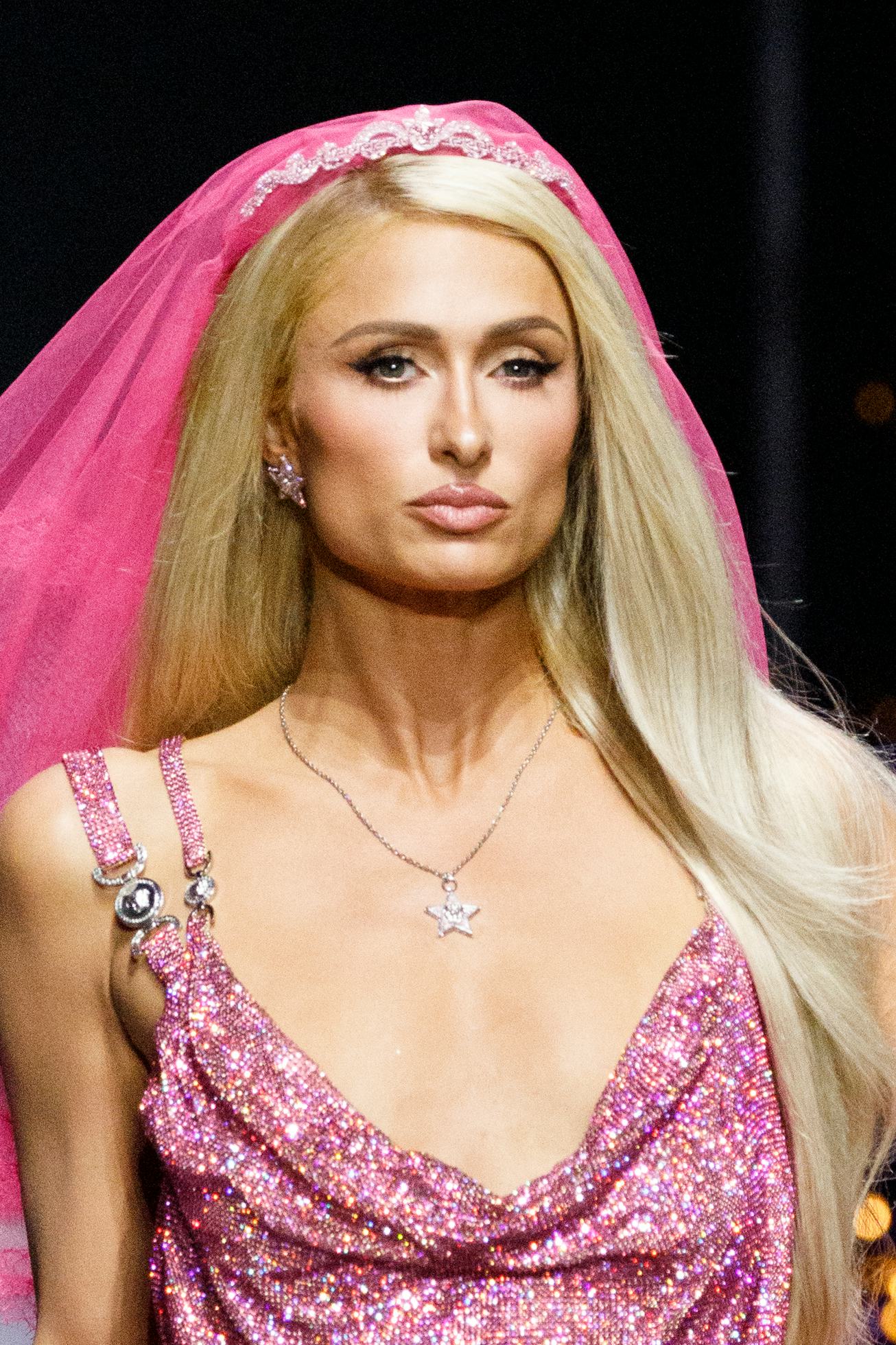MILAN, ITALY - SEPTEMBER 23: Paris Hilton walks the runway of the Versace Fashion Show during the Mi...