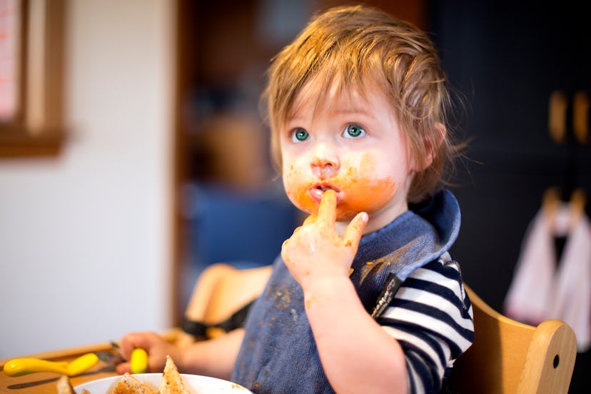 baby covered in food in an article about baby-led weaning