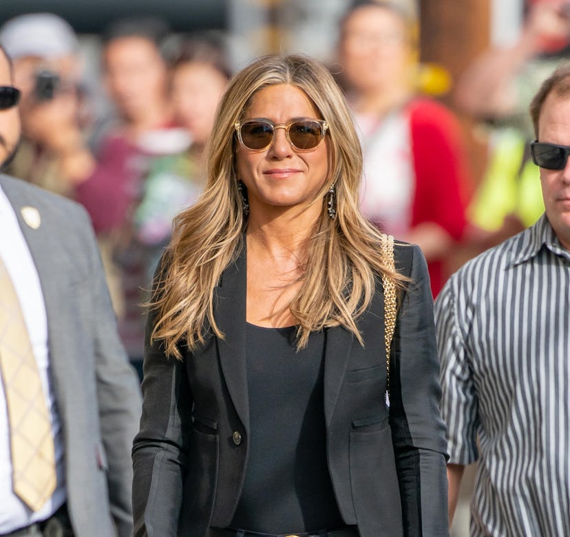 Jennifer Aniston wearing a fall outfit.