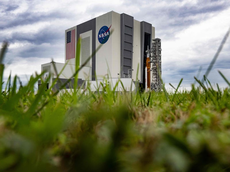 The Artemis I unmanned lunar rocket is rolled back it the Vehicle Assembly Building at Kennedy Space...