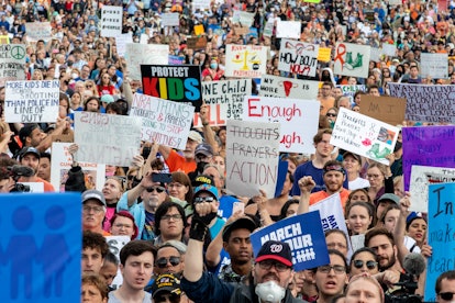 Crowds with signs gather at the March for our Lives rally against gun violence at the National Mall ...