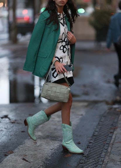 A fashion week guest seen wearing a bottega veneta bag and a Jacquemus oversize blouse, outside Jacq...