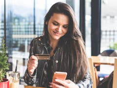 A woman looking at her budget uses the No Spend Month Challenge In College According To TikTok