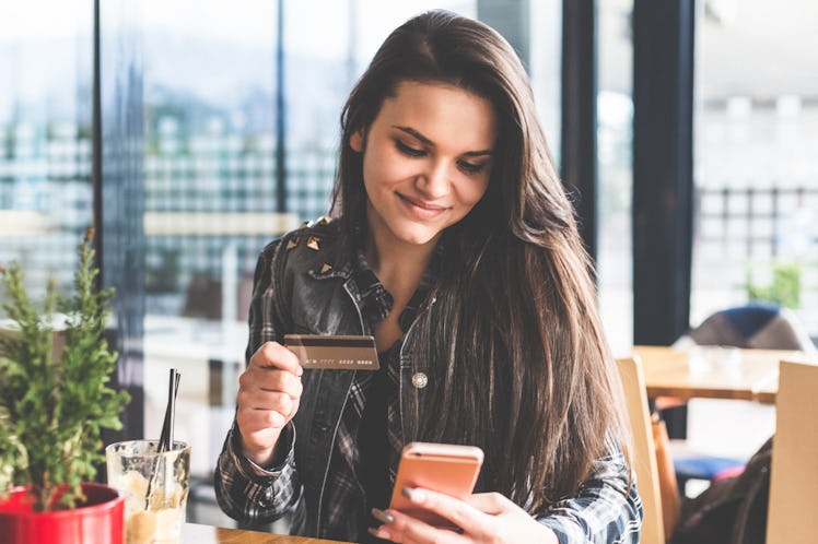 A woman looking at her budget uses the No Spend Month Challenge In College According To TikTok