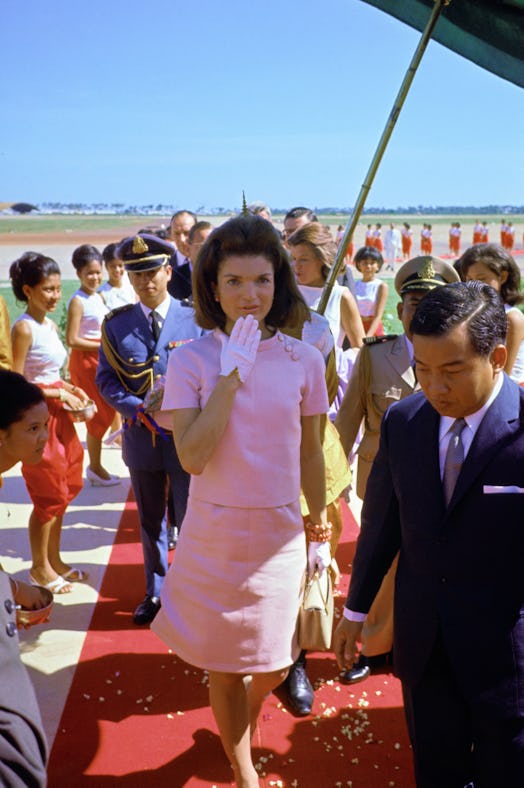 jackie kennedy wearing a pink set in cambodia 