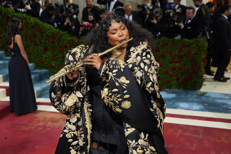 NEW YORK, NEW YORK - MAY 02: Lizzo plays the flute at the 2022 Costume Institute Benefit celebrating...