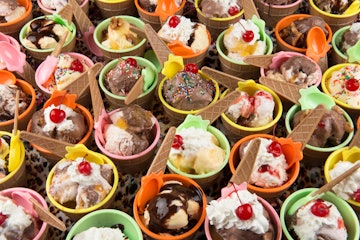 A variety of ice cream desserts placed next to each other in differing colors
