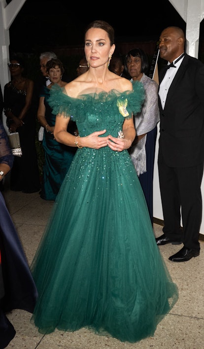 Kate Middleton wears a sparkly green gown with a ruffled neckline as part of Kate Middleton's fashio...