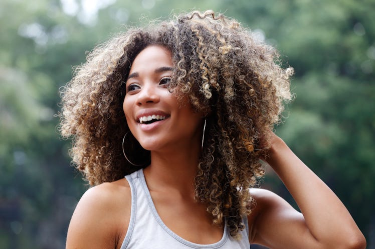 learn how to style curly hair in humidity, according to experts, for frizz-free curly hair like the ...