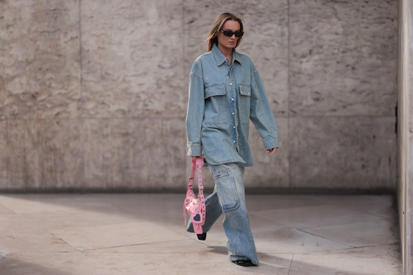 A fashion week guest seen wearing a matching amiri denim look 