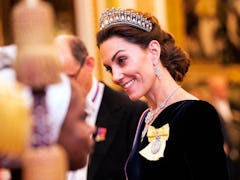 Kate Middleton wearing a diamond tiara as part of Kate Middleton's fashion evolution at Buckingham P...