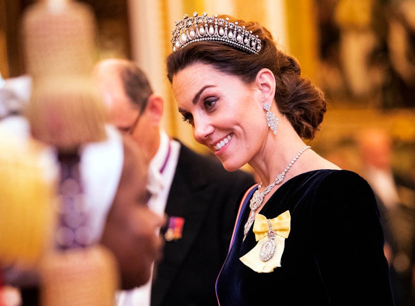 Kate Middleton wearing a diamond tiara as part of Kate Middleton's fashion evolution at Buckingham P...