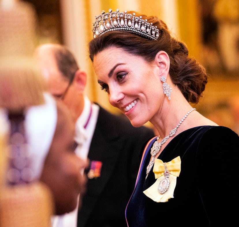Kate Middleton wearing a diamond tiara as part of Kate Middleton's fashion evolution at Buckingham P...
