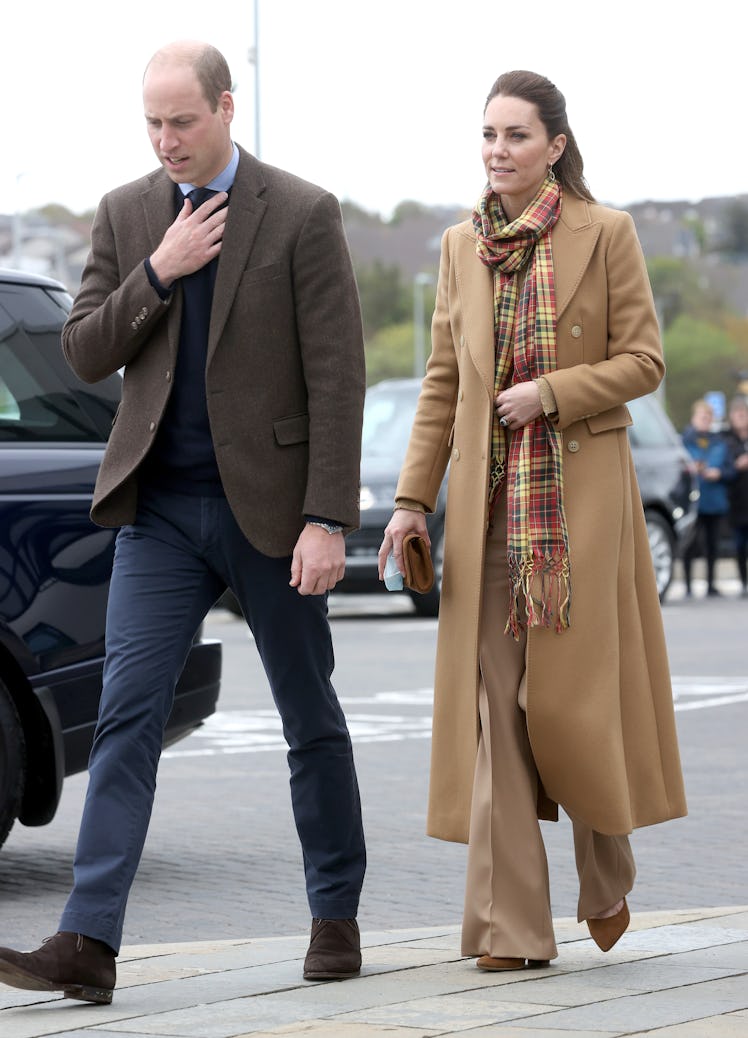 Kate Middleton wears a beige monochromatic outfit with tartan scarf as part of Kate Middleton's fash...