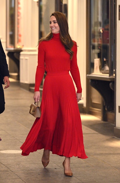 Kate Middleton wears a red two piece outfit as part of Kate Middleton's fashion evolution and depart...