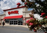 HYATTSVILLE, MD - AUGUST 17: Shoppers come and go the TJ Maxx store at the Mall at Prince George's o...