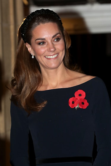 Kate Middleton wears a padded headband while she attends the annual Royal British Legion Festival of...