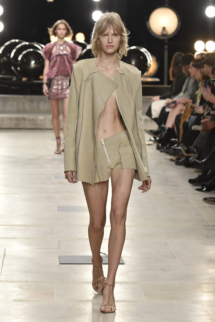 A model walking the runway at the Isabel Marant Ready to Wear Spring/Summer 2023 fashion show in a l...