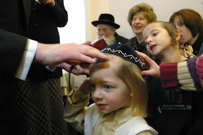 3rd birthday of a Orthodox Jewish boy he has his first ever hair cut leaving his peyos (sideburns) t...
