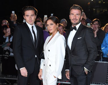 LONDON, ENGLAND - SEPTEMBER 03: Brooklyn Beckham, Victoria Beckham and David Beckham attend the GQ M...