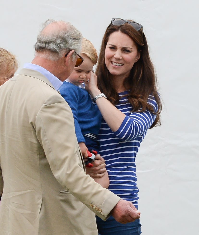 Prince Charles hangs out with Prince George.
