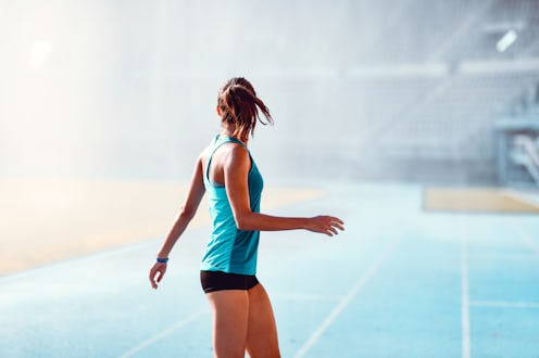 Female Athlete Enjoying Running In The Rain