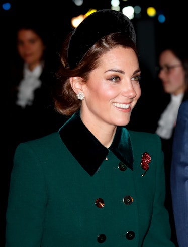 Kate Middleton wearing a padded headband as she attends a service to mark the centenary of the Armis...