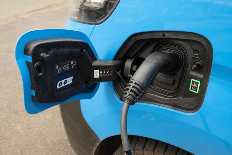 Staffordshire, England, UK - Close up of a type C domestic electric vehicle charging unit plugged in...
