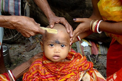 Hindu child first hair cut.