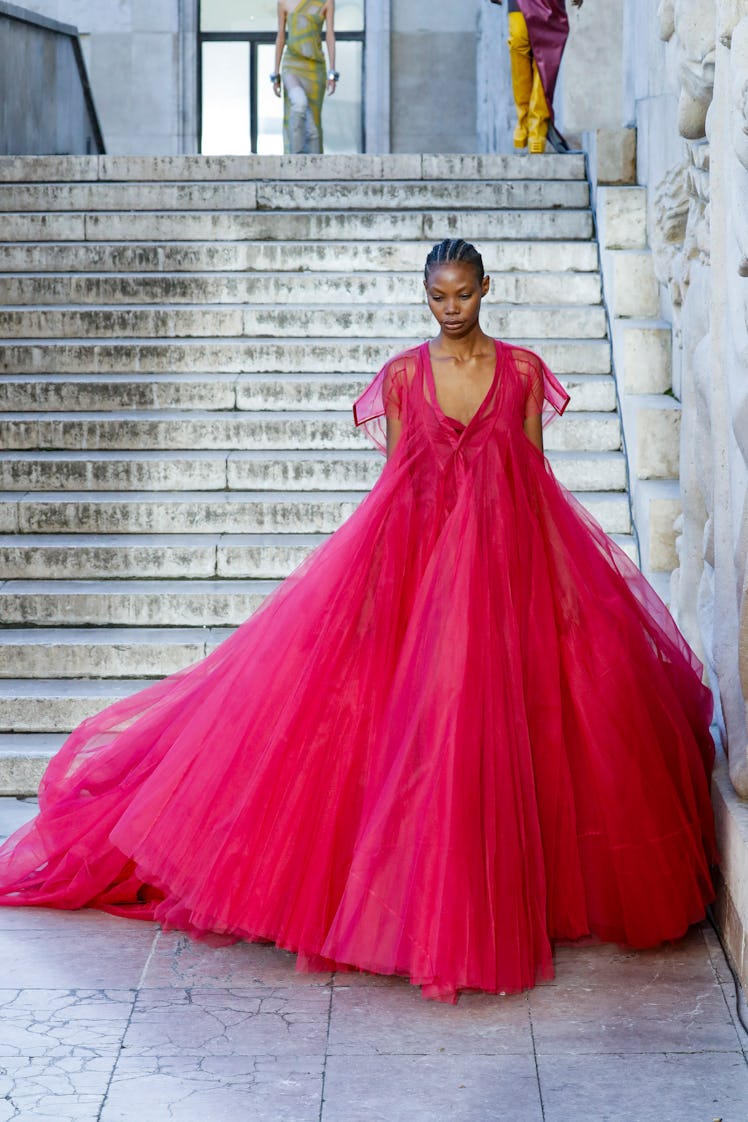 A model wearing Rick Owens’s vibrant pink maxi puffy dress at Paris Fashion Week Spring 2023