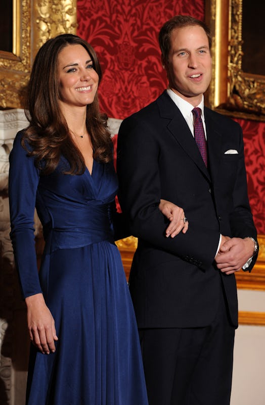 Britain's Prince William and his fiancée Kate Middleton pose for photographers during a photocall to...