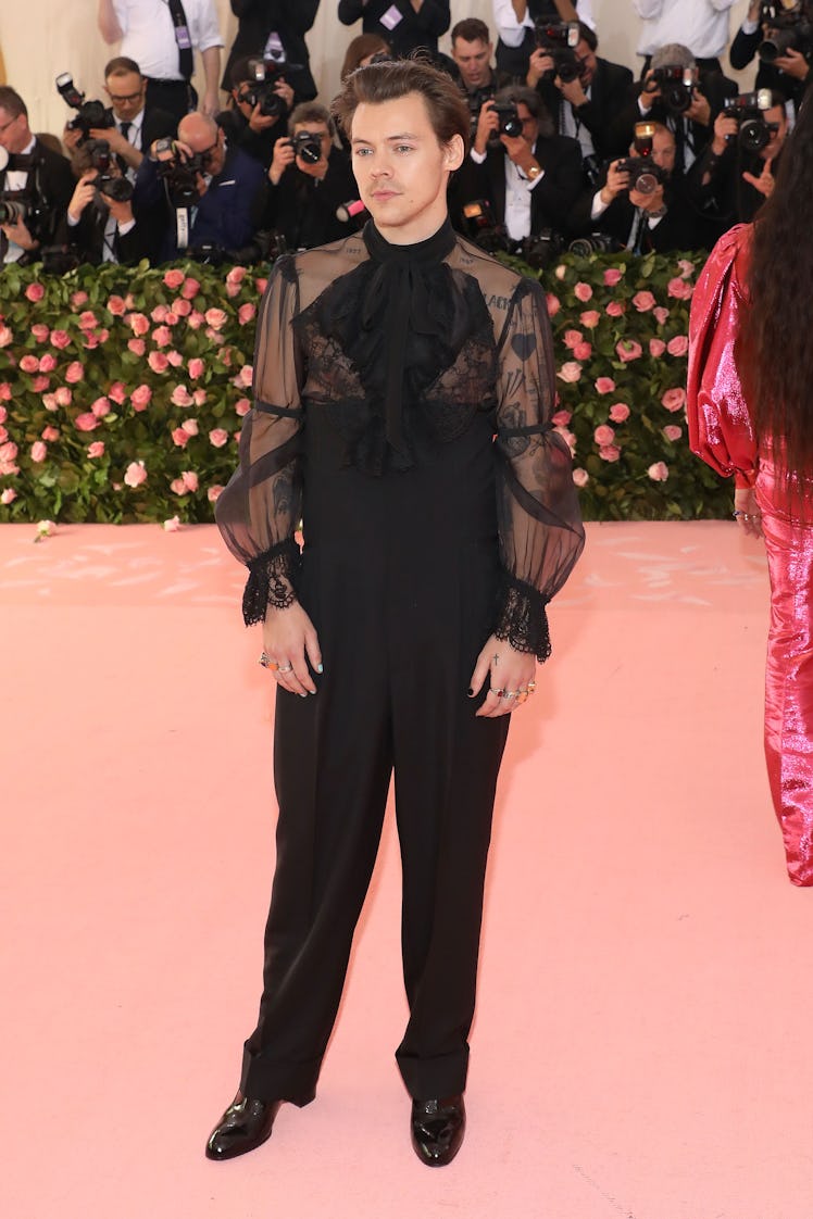 Harry Styles' Style Evolution: his Met Gala look designed by Alessandro Michele attends the 2019 Met...