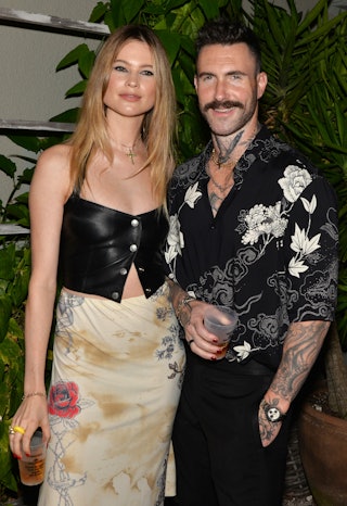 Behati Prinsloo and Adam Levine are expecting baby number three! Here they pose at the Calirosa Tequ...